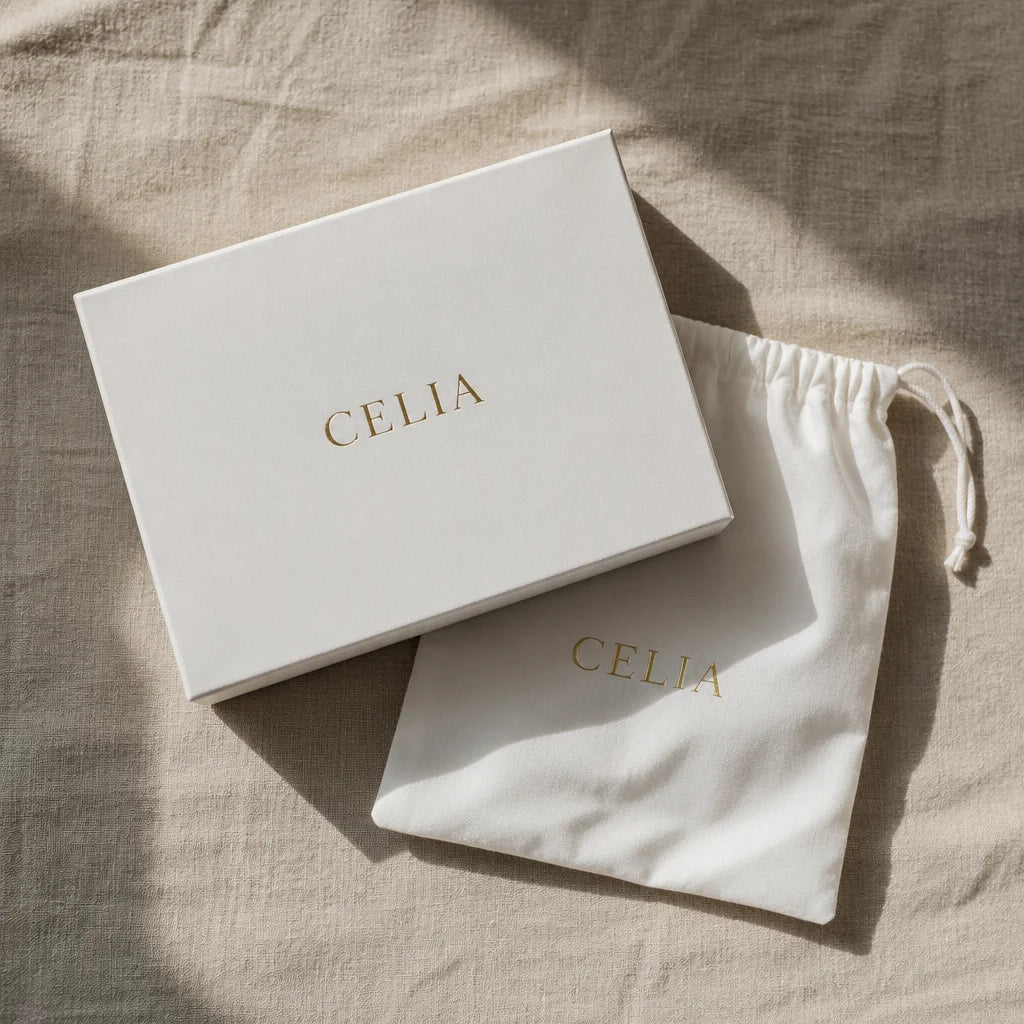 Editorial magazine still-life photograph, overhead styling. Overhead flat-lay of the white CELIA pac