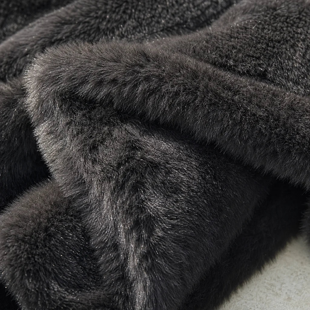 Premium detail macro photography. A macro close-up of the luxurious faux fur of a CELIA coat, each f